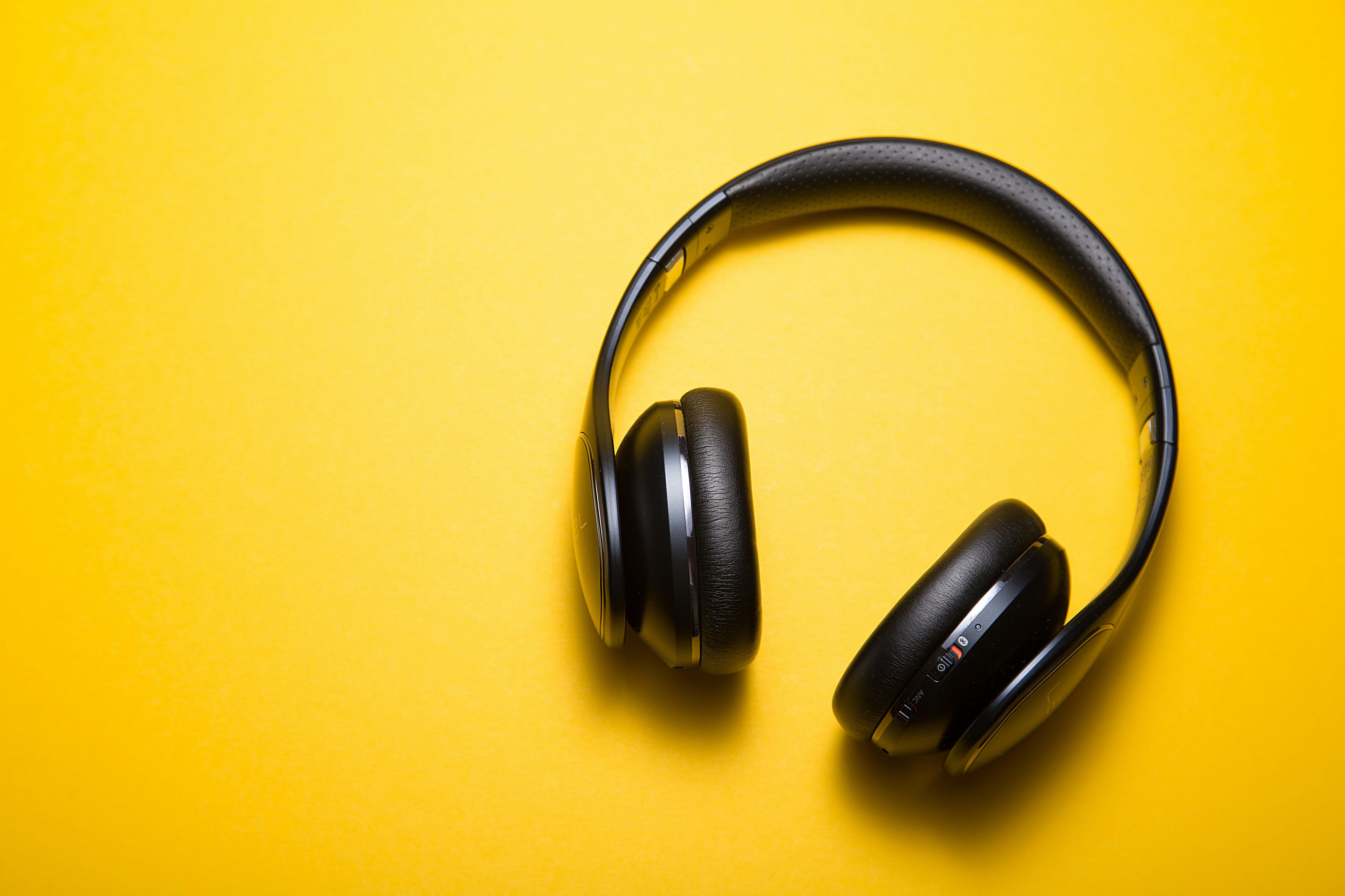Headphones and audio production desk representing a safer AI voice cloning workflow